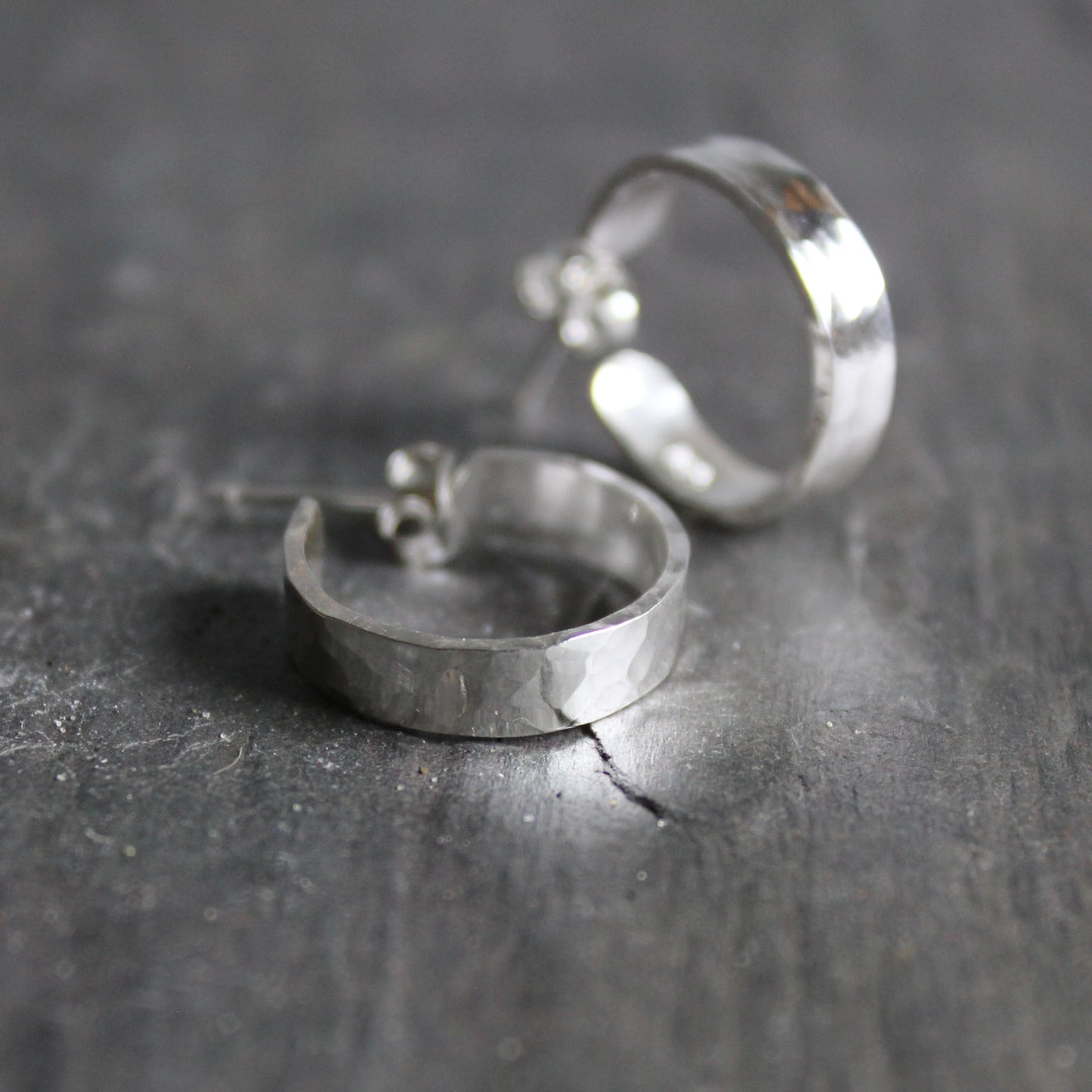 These hoop earrings are approximately 4mm wide and 1mm thick and the hoops are about 1/2" in diameter and finished on sterling silver posts.