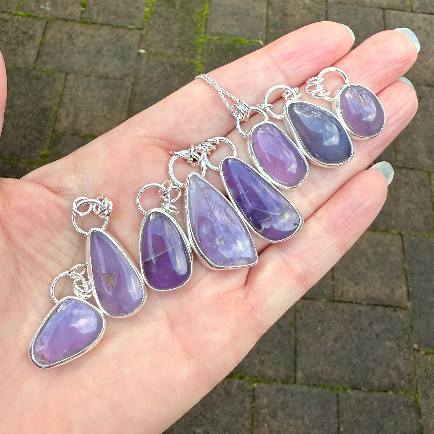 This pendant has a large Oregon Holley Blue agate cabochon that is set in a fine and sterling silver bezel setting and comes with a sterling silver chain. Handmade by Will Macy in Corvallis, OR.