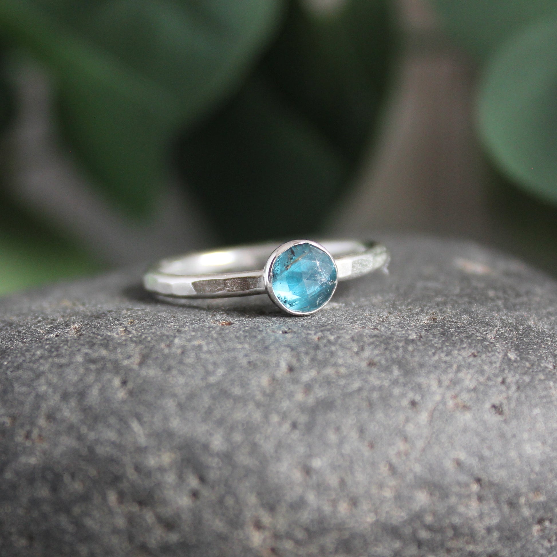 6mm rose cut teal moss kyanite set in a sterling silver bezel setting on a sturdy silver band. 