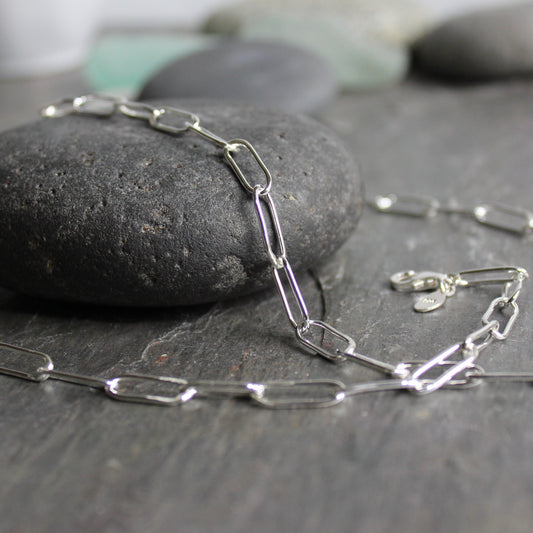 A sterling silver paperclip link chain handmade with 18 gauge sterling silver wire and finished with a lobster clasp. 