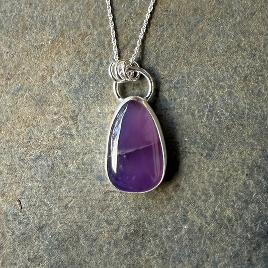 This pendant has a large Oregon Holley Blue agate cabochon that is set in a fine and sterling silver bezel setting and comes with a sterling silver chain.  Handmade by Will Macy in Corvallis, OR.