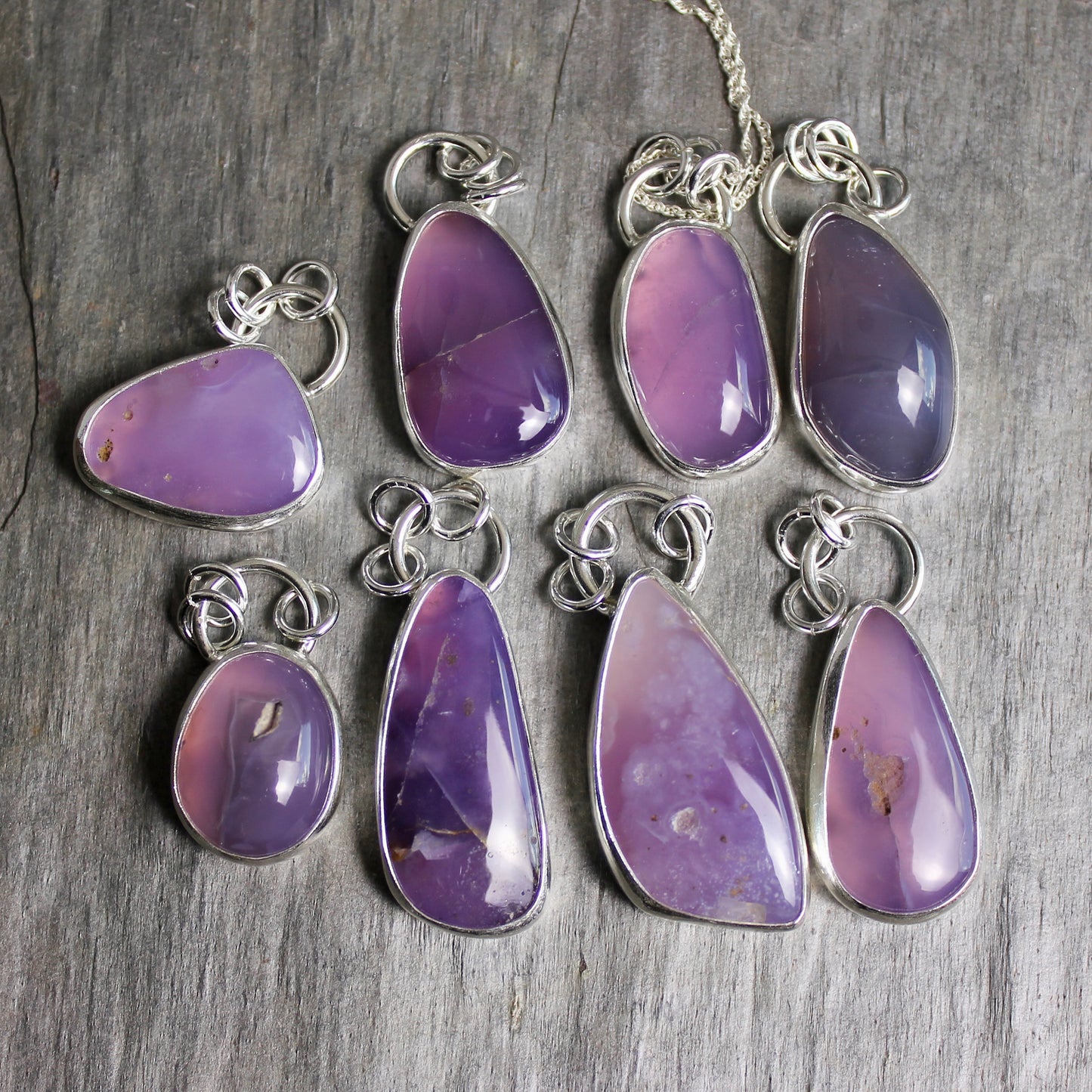 This pendant has a large Oregon Holley Blue agate cabochon that is set in a fine and sterling silver bezel setting and comes with a sterling silver chain. Handmade by Will Macy in Corvallis, OR.