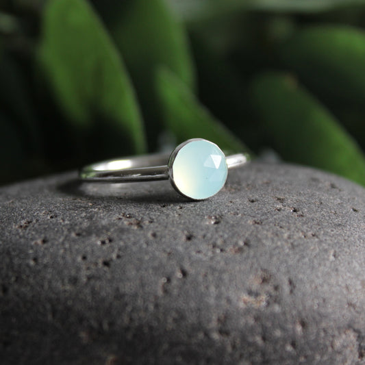Stunning rose cut (faceted) Peruvian blue chalcedony round cabochon set in a sterling silver bezel setting on a narrow silver band.  Available in 6mm and 8mm diameter. 