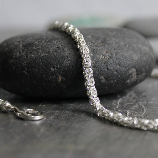 This is a delicate handmade sterling silver Byzantine chain.  Made with very small 22 gauge sterling silver wire each individually cut and woven to make this artisan chain. 