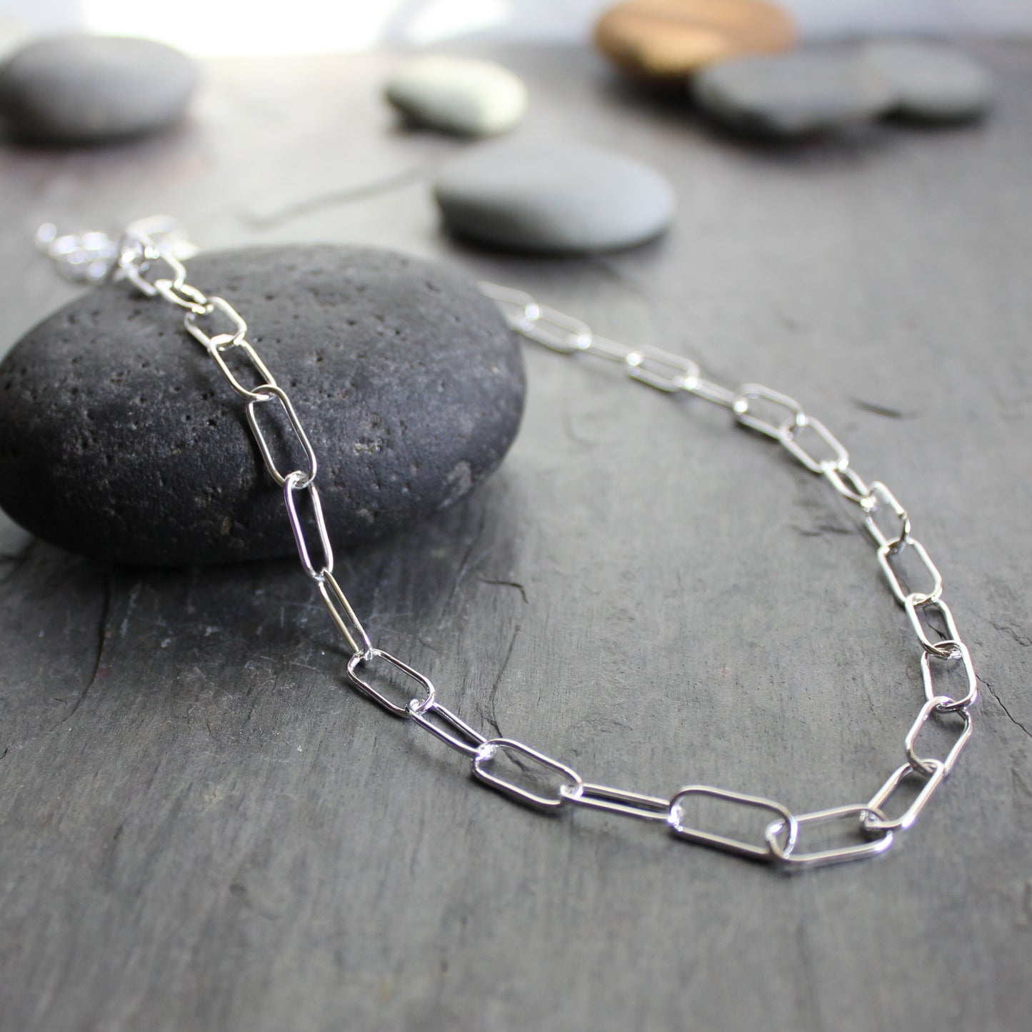 This is a handmade chain made with 18 gauge sterling silver wire. Each link is individually linked, soldered, and shaped by hand. 