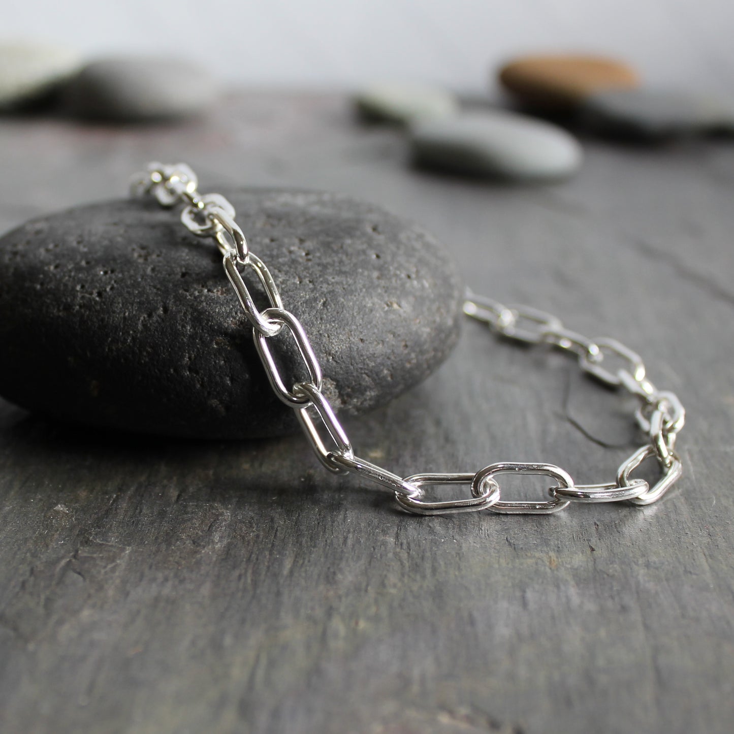 This is a handmade chain made with 14 gauge sterling silver wire. Each link is individually linked, soldered, and shaped by hand. 