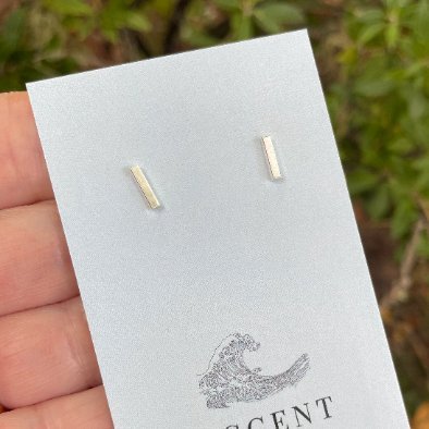 sterling silver bar studs that are approximately 8mm in length.