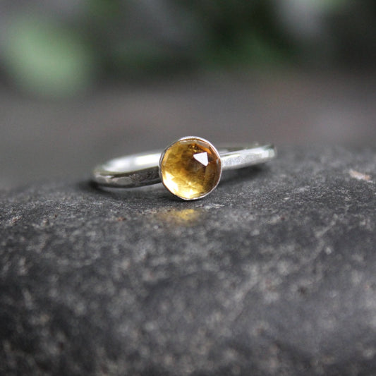 This ring has either a 5mm or 7mm rose cut citrine set in a sterling silver bezel setting on a sturdy silver band. 