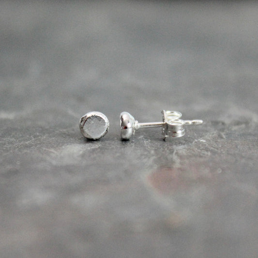 Recycled sterling silver tiny dot stud earrings — a best-selling handmade jewelry item at craft fairs and markets