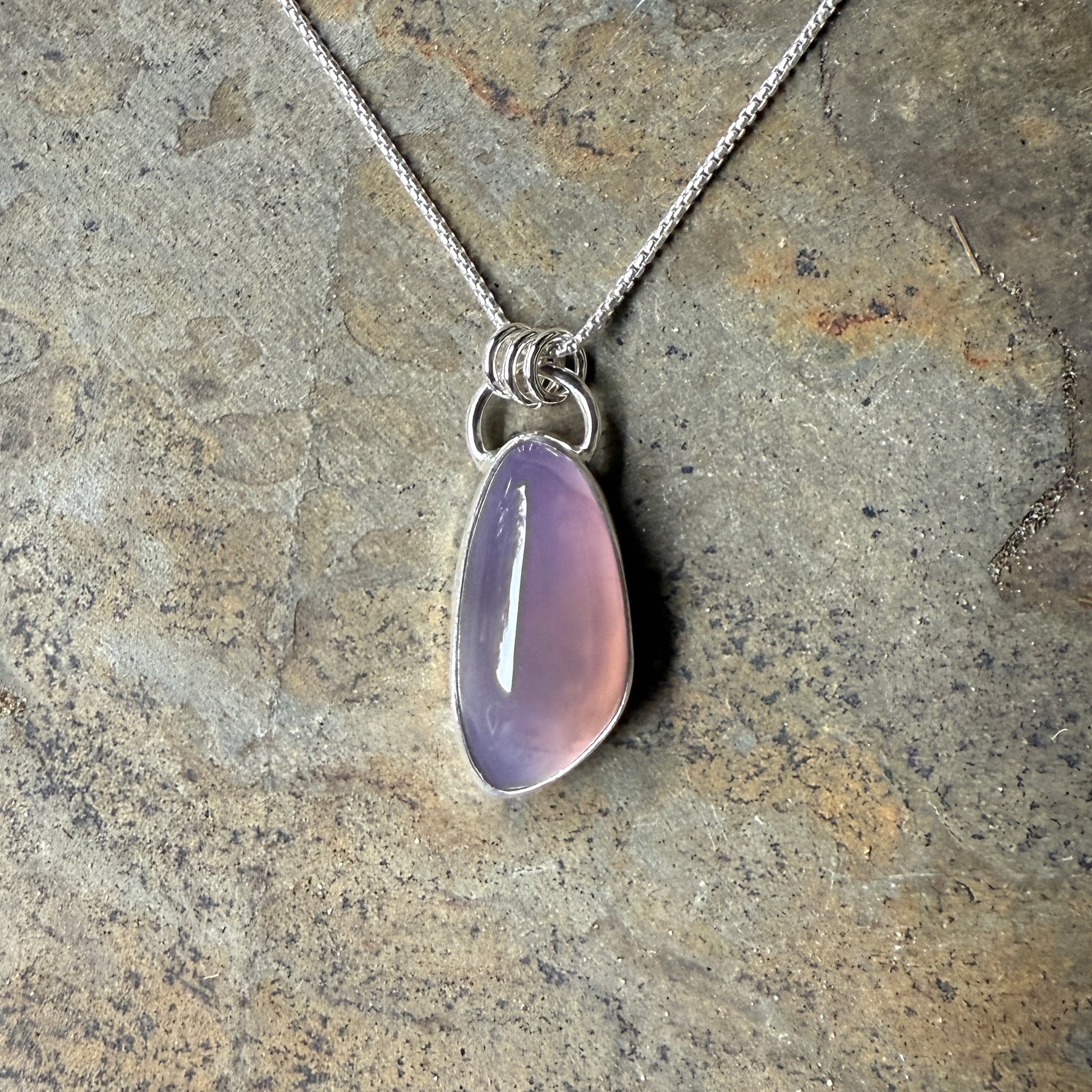 This is a large Oregon holley blue agate cabochon that is set in a fine and sterling silver bezel setting on a sturdy sterling silver chain.  