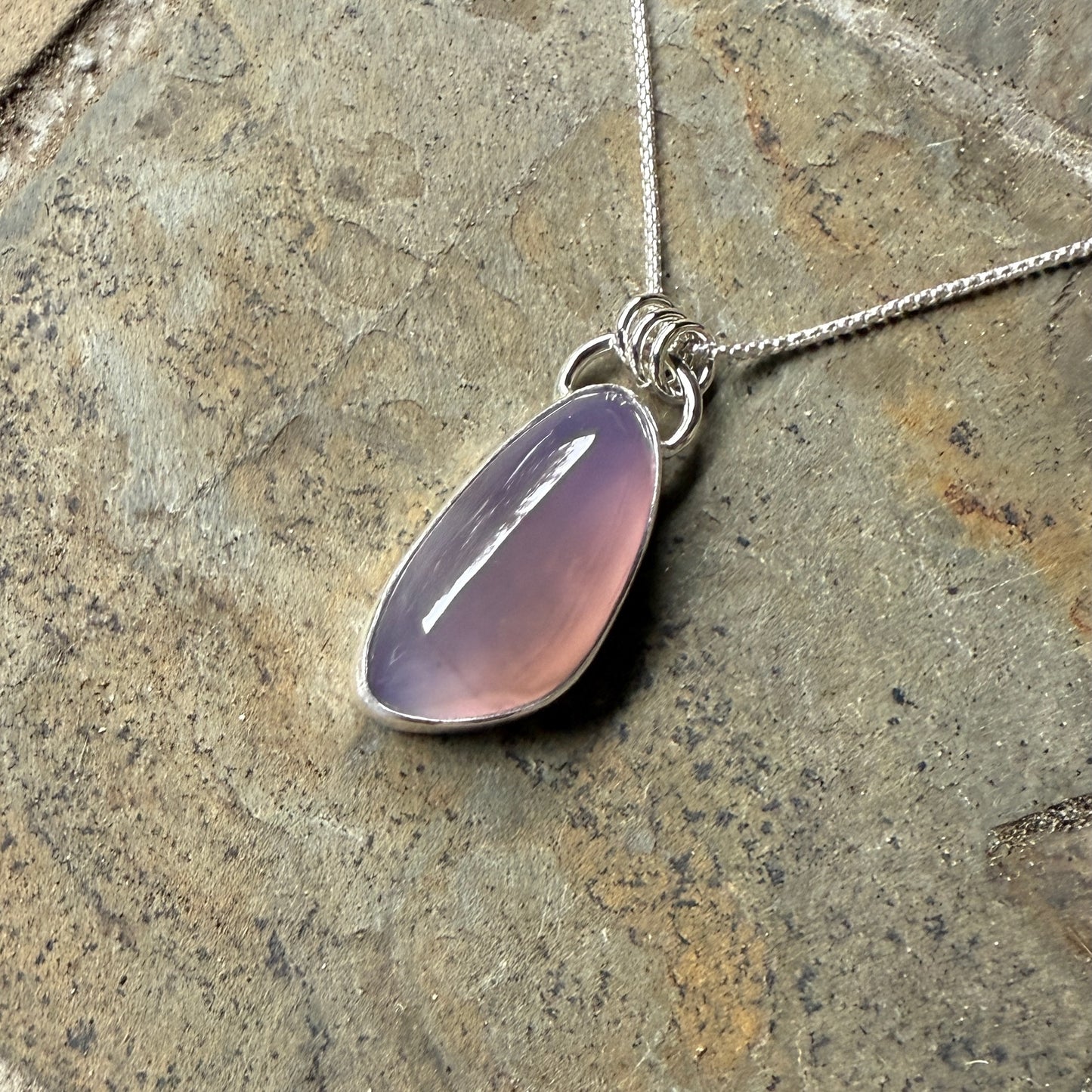 This is a large Oregon holley blue agate cabochon that is set in a fine and sterling silver bezel setting on a sturdy sterling silver chain.  