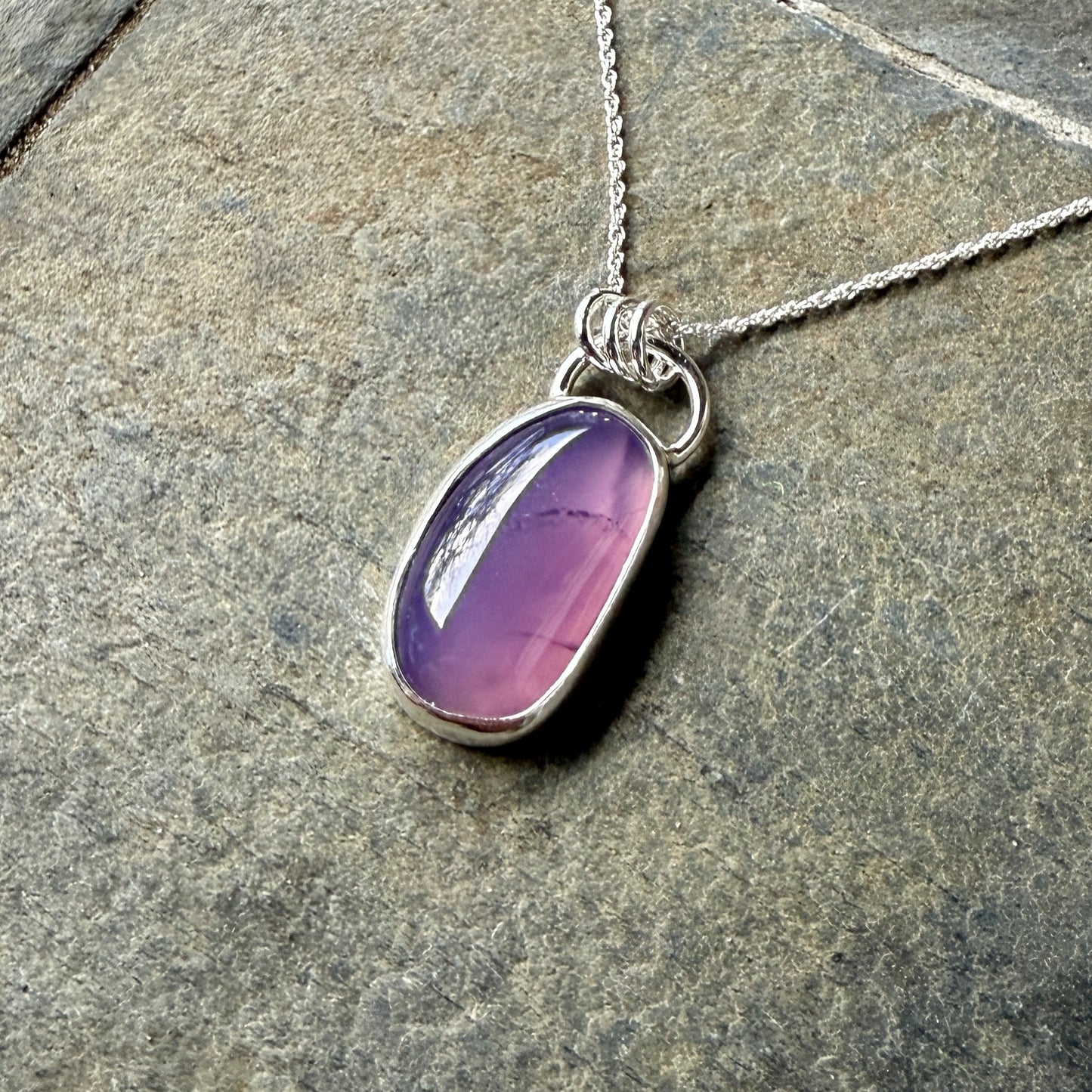 This pendant has a large Oregon Holley Blue agate cabochon that is set in a fine and sterling silver bezel setting and comes with a sterling silver chain.  Handmade by Will Macy in Corvallis, OR.