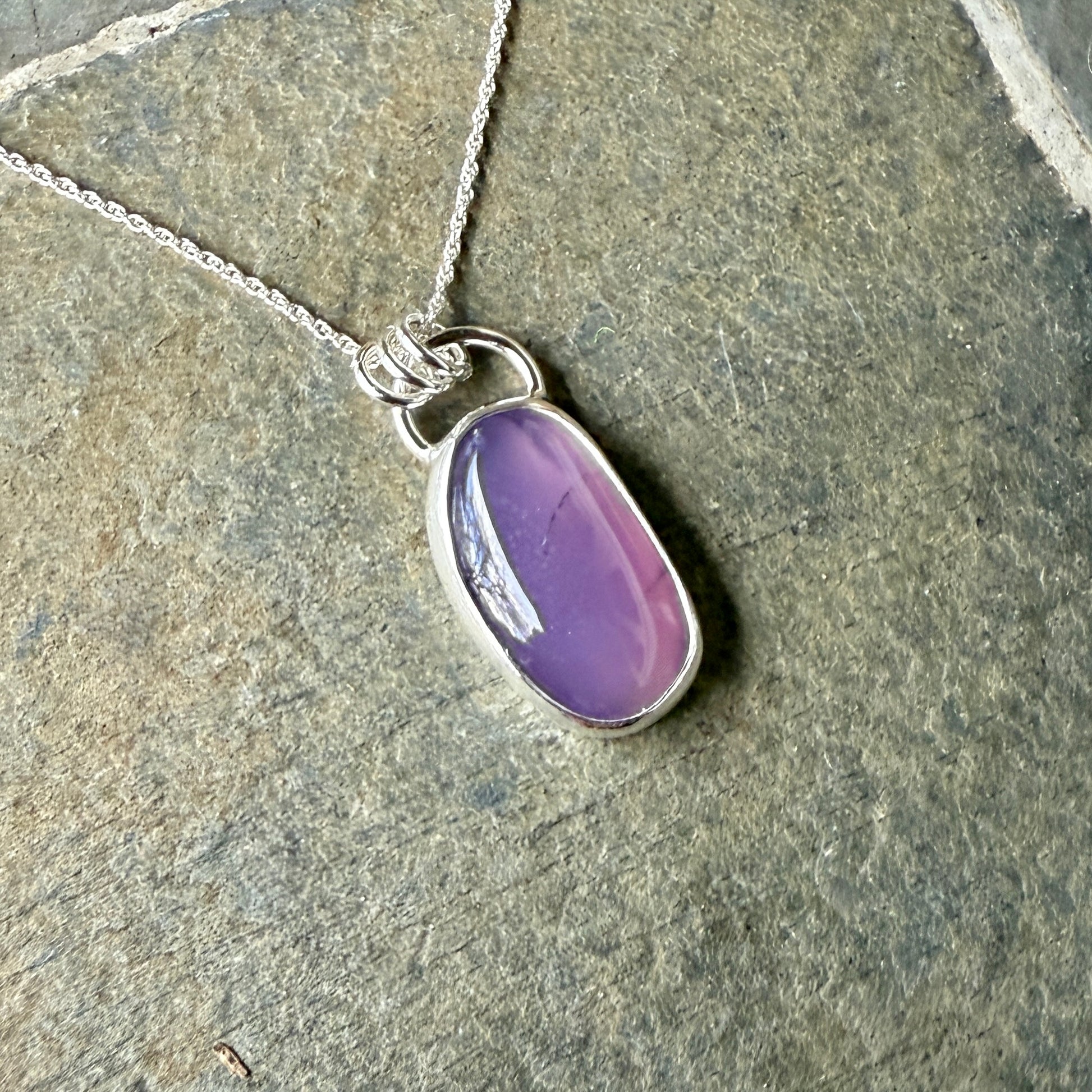 This pendant has a large Oregon Holley Blue agate cabochon that is set in a fine and sterling silver bezel setting and comes with a sterling silver chain.  Handmade by Will Macy in Corvallis, OR.