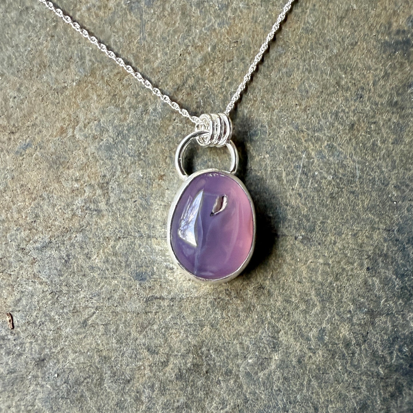 This pendant has a large Oregon Holley Blue agate cabochon that is set in a fine and sterling silver bezel setting and comes with a sterling silver chain.  Handmade by Will Macy in Corvallis, OR.