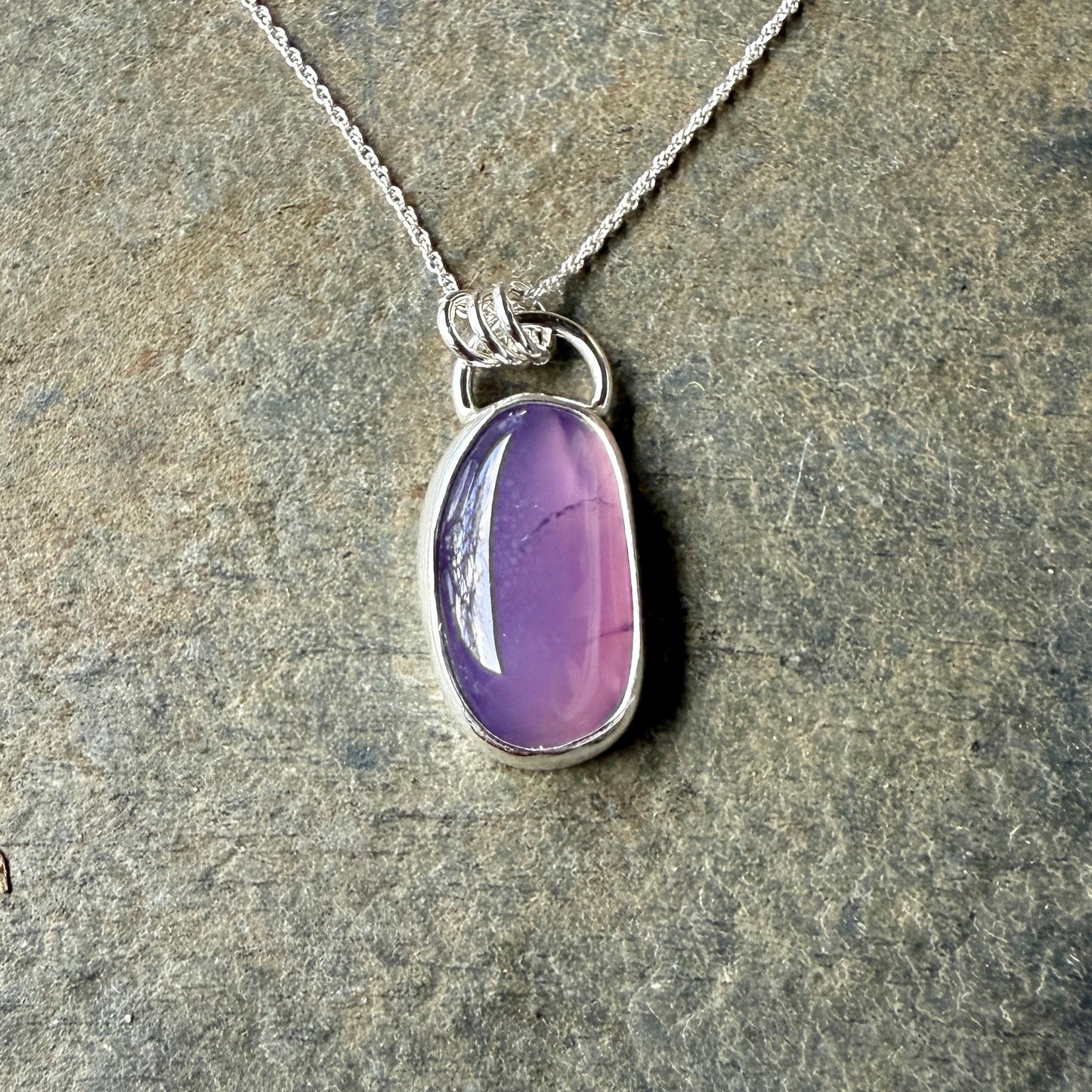 This pendant has a large Oregon Holley Blue agate cabochon that is set in a fine and sterling silver bezel setting and comes with a sterling silver chain.  Handmade by Will Macy in Corvallis, OR.