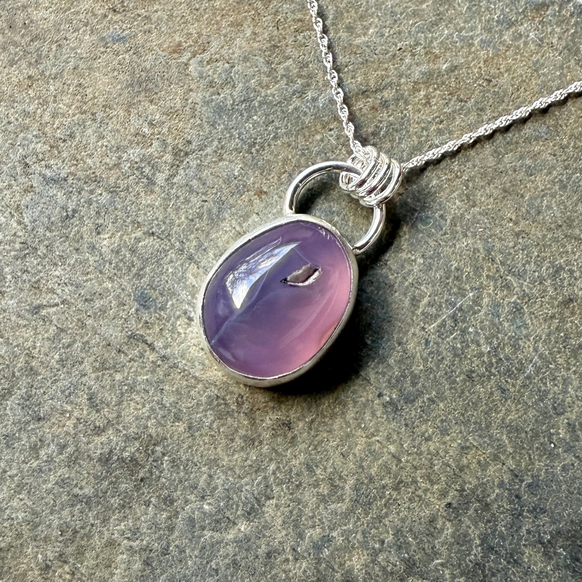 This pendant has a large Oregon Holley Blue agate cabochon that is set in a fine and sterling silver bezel setting and comes with a sterling silver chain.  Handmade by Will Macy in Corvallis, OR.