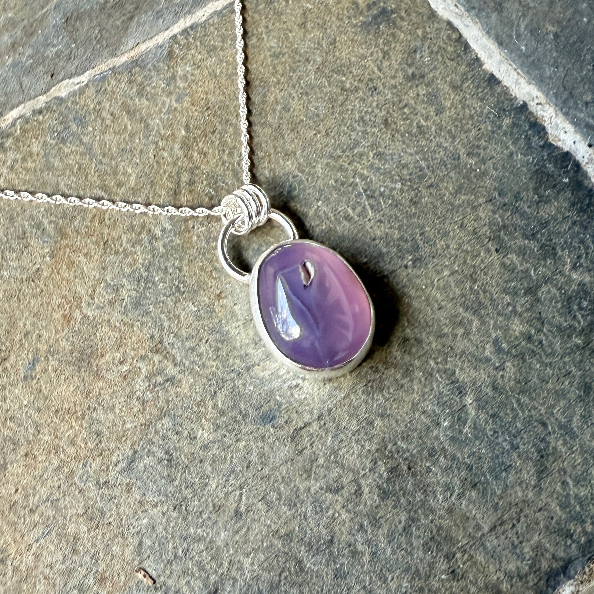 This pendant has a large Oregon Holley Blue agate cabochon that is set in a fine and sterling silver bezel setting and comes with a sterling silver chain.  Handmade by Will Macy in Corvallis, OR.