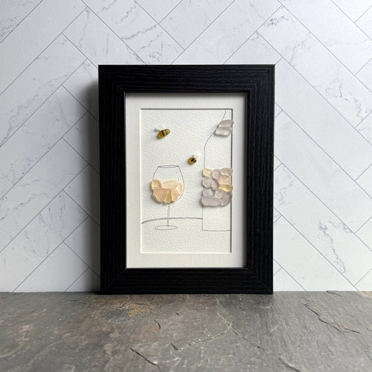 Framed artwork with abstract design on a marble wall background