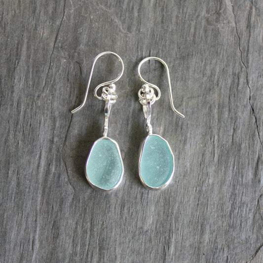 For these pretty earrings, I used 2 pieces of pale blue sea glass from Japan that are set in a sterling & fine silver bezel setting and are on sterling silver ear wires. All of our sea glass is found and never altered in any way. This item was handmade by Barb Macy in Corvallis, OR.
