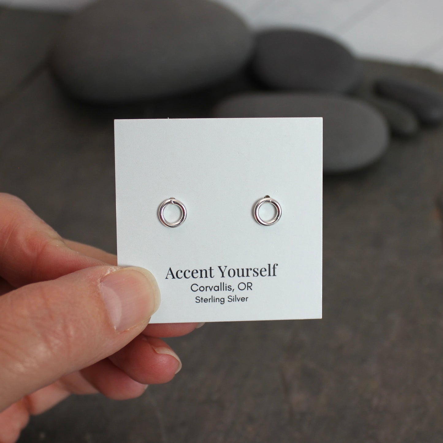 These cute little stud earrings have simple 8-10mm jump rings solders onto sterling silver posts and completed with ear nuts. Handmade by Barb Macy in Corvallis, Oregon.