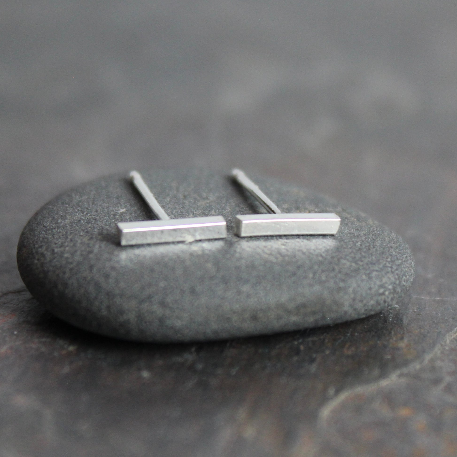sterling silver bar studs that are approximately 8mm in length. 