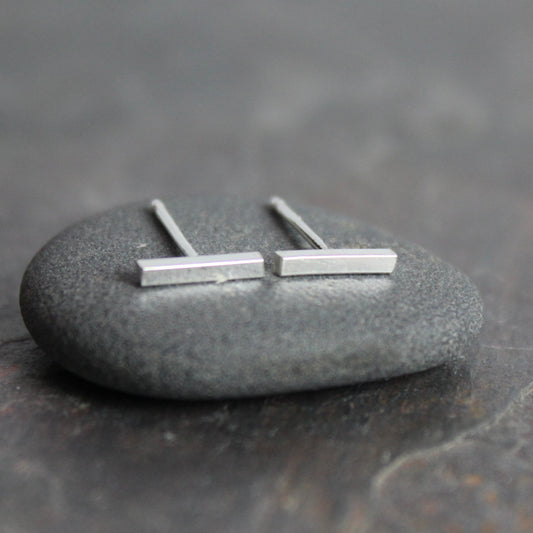 sterling silver bar studs that are approximately 8mm in length. 