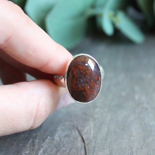 This ring has an oval red agate ring that is made with a locally-sourced &amp; cut cabochon and set in fine &amp; sterling silver on a sturdy silver band.