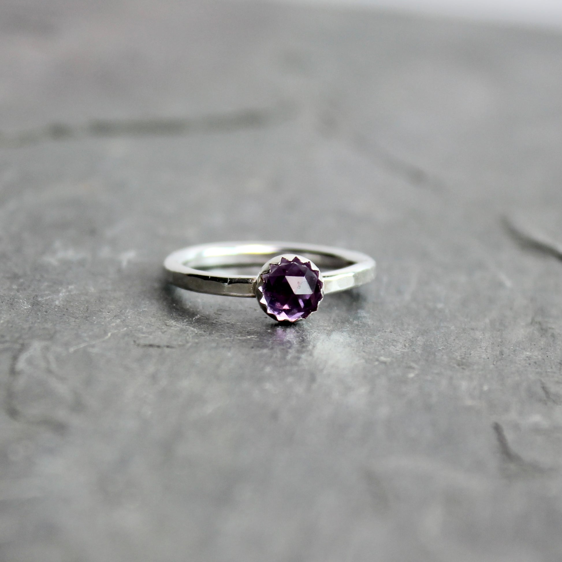 a sterling silver ring with an alexandrite stone
