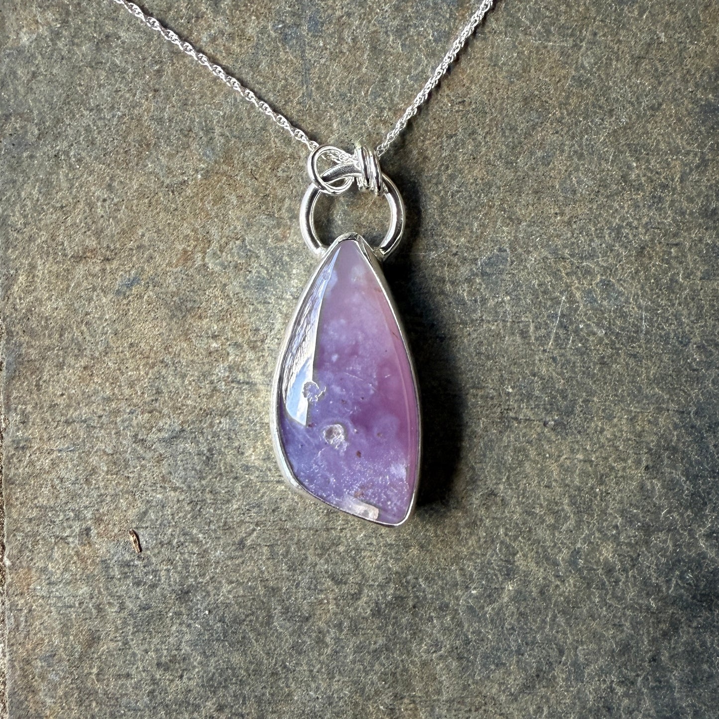 This pendant has a large Oregon Holley Blue agate cabochon that is set in a fine and sterling silver bezel setting and comes with a sterling silver chain.  Handmade by Will Macy in Corvallis, OR.