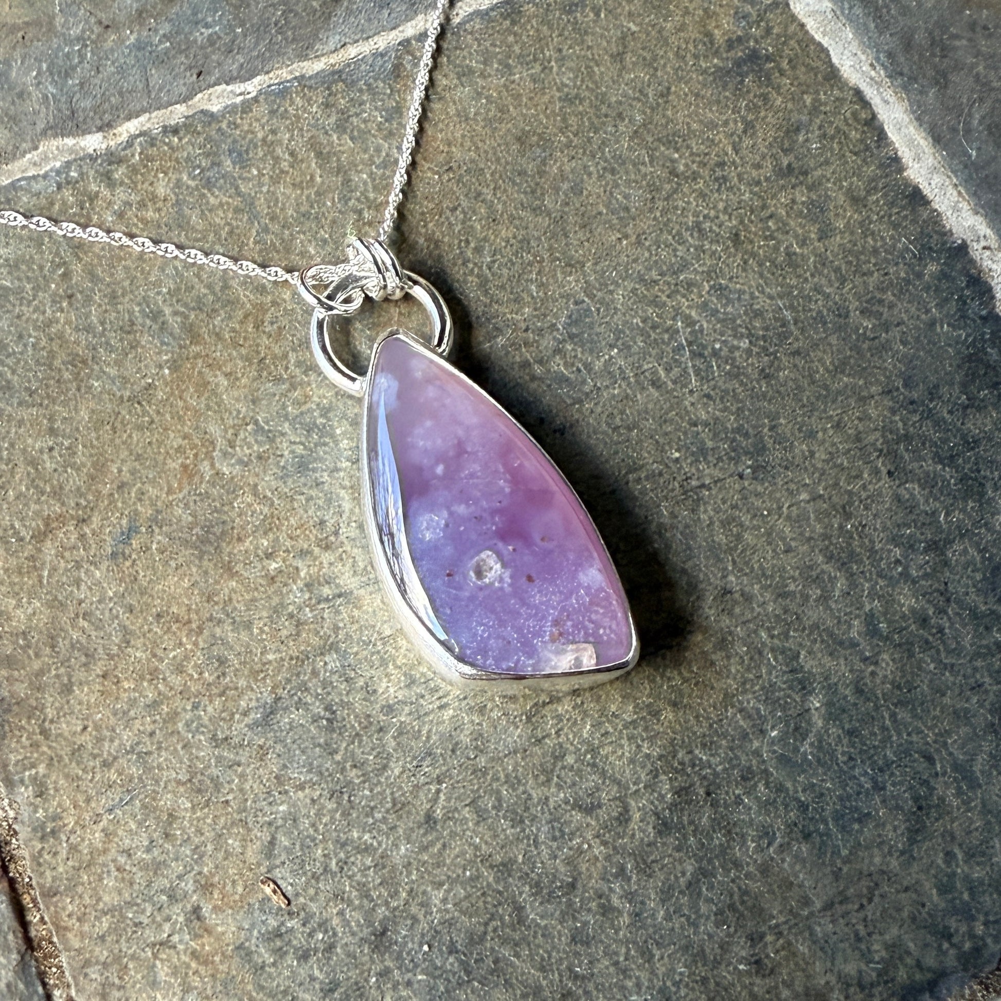 This pendant has a large Oregon Holley Blue agate cabochon that is set in a fine and sterling silver bezel setting and comes with a sterling silver chain.  Handmade by Will Macy in Corvallis, OR.