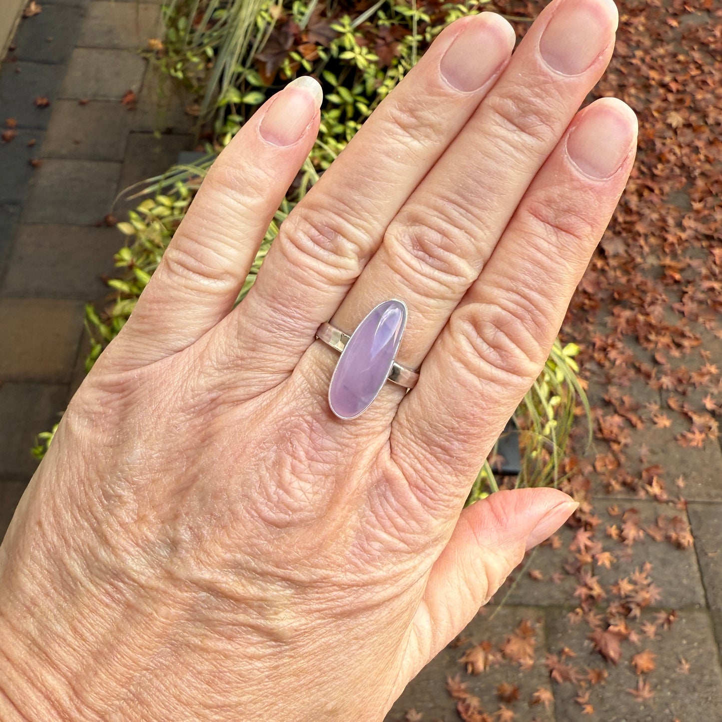 hand wearing a sterling silver holley blue agate statement ring