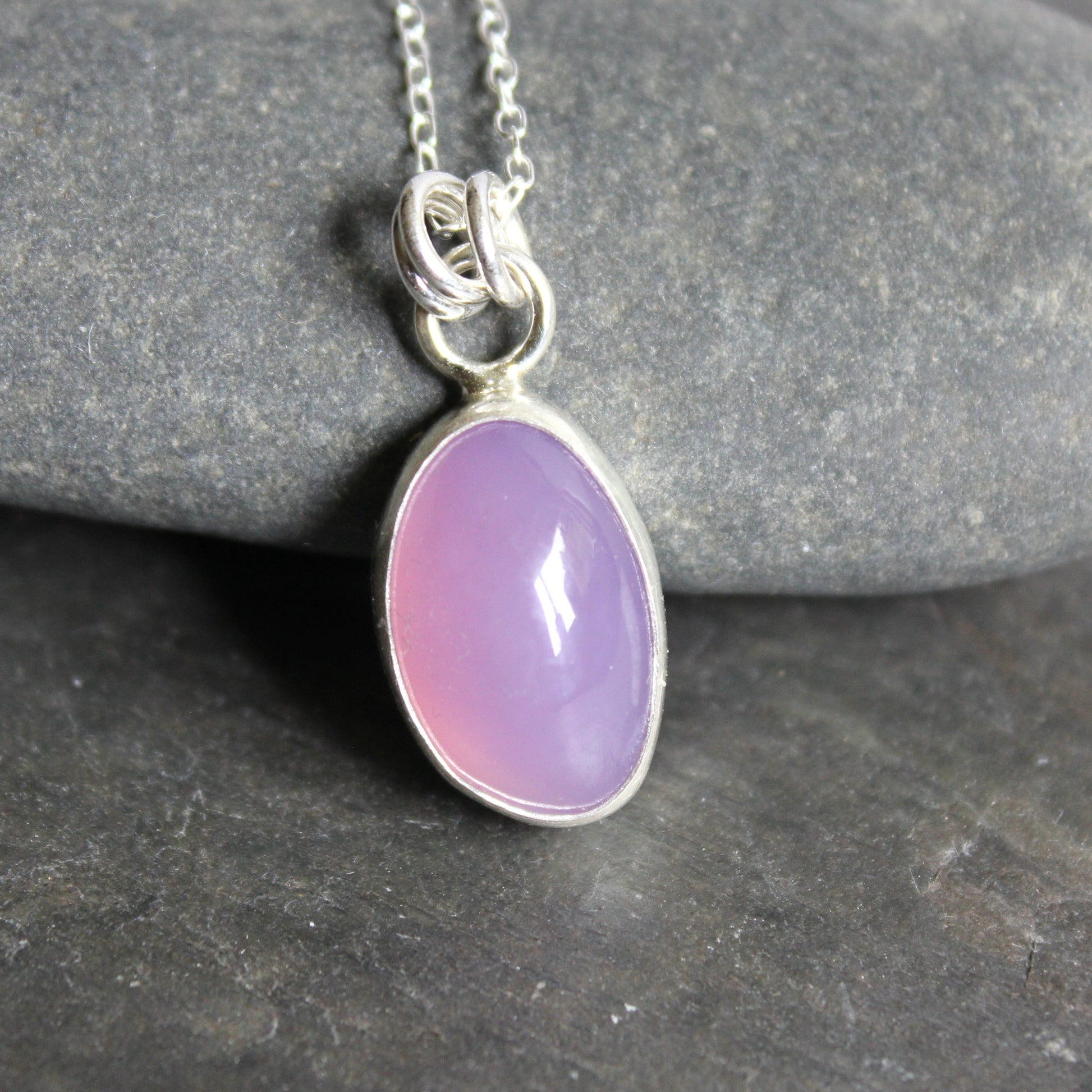 Holley Blue Agate pendant necklace on a dark stone surface