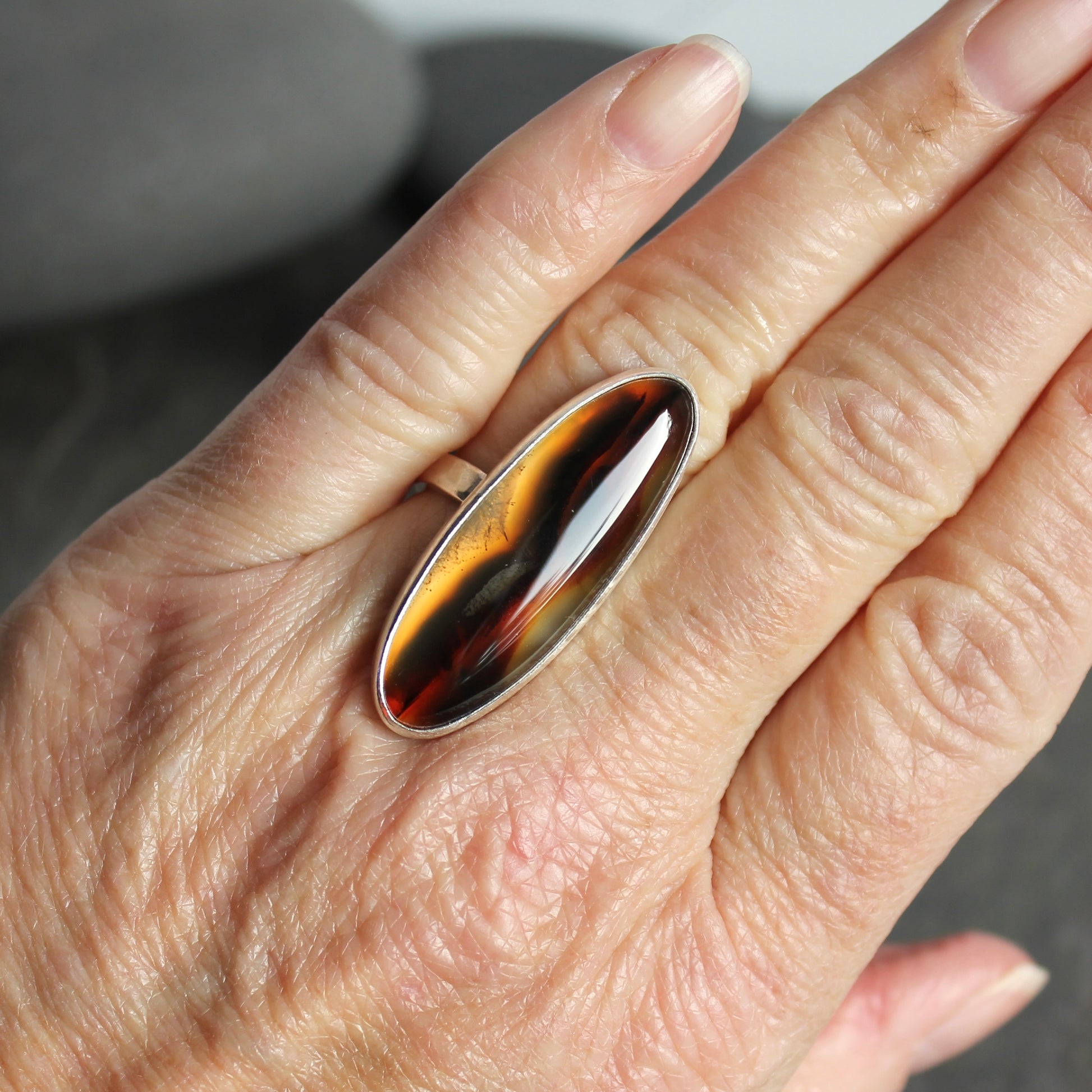 large oval montana agate bezel set ring set in sterling silver
