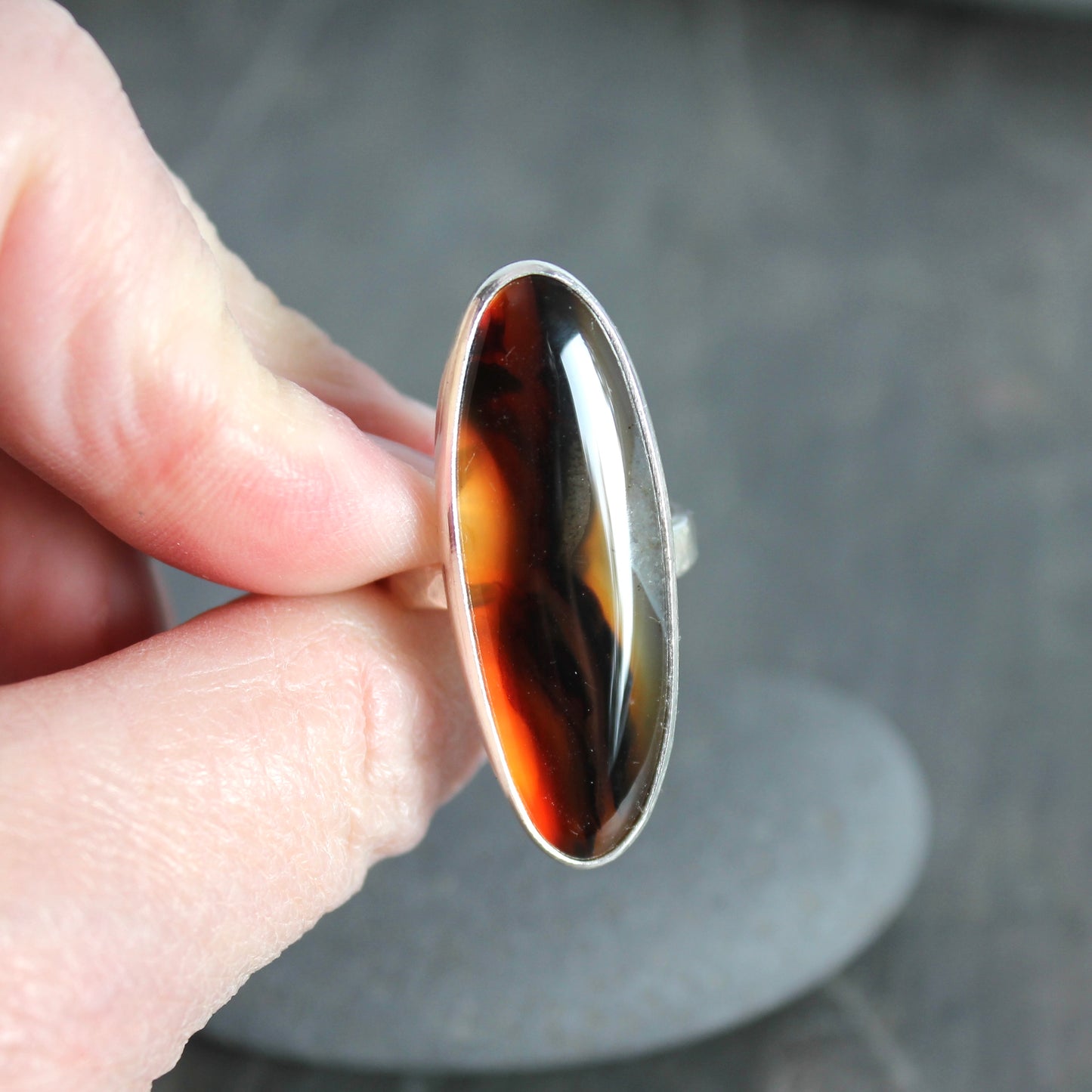 large oval montana agate bezel set ring set in sterling silver