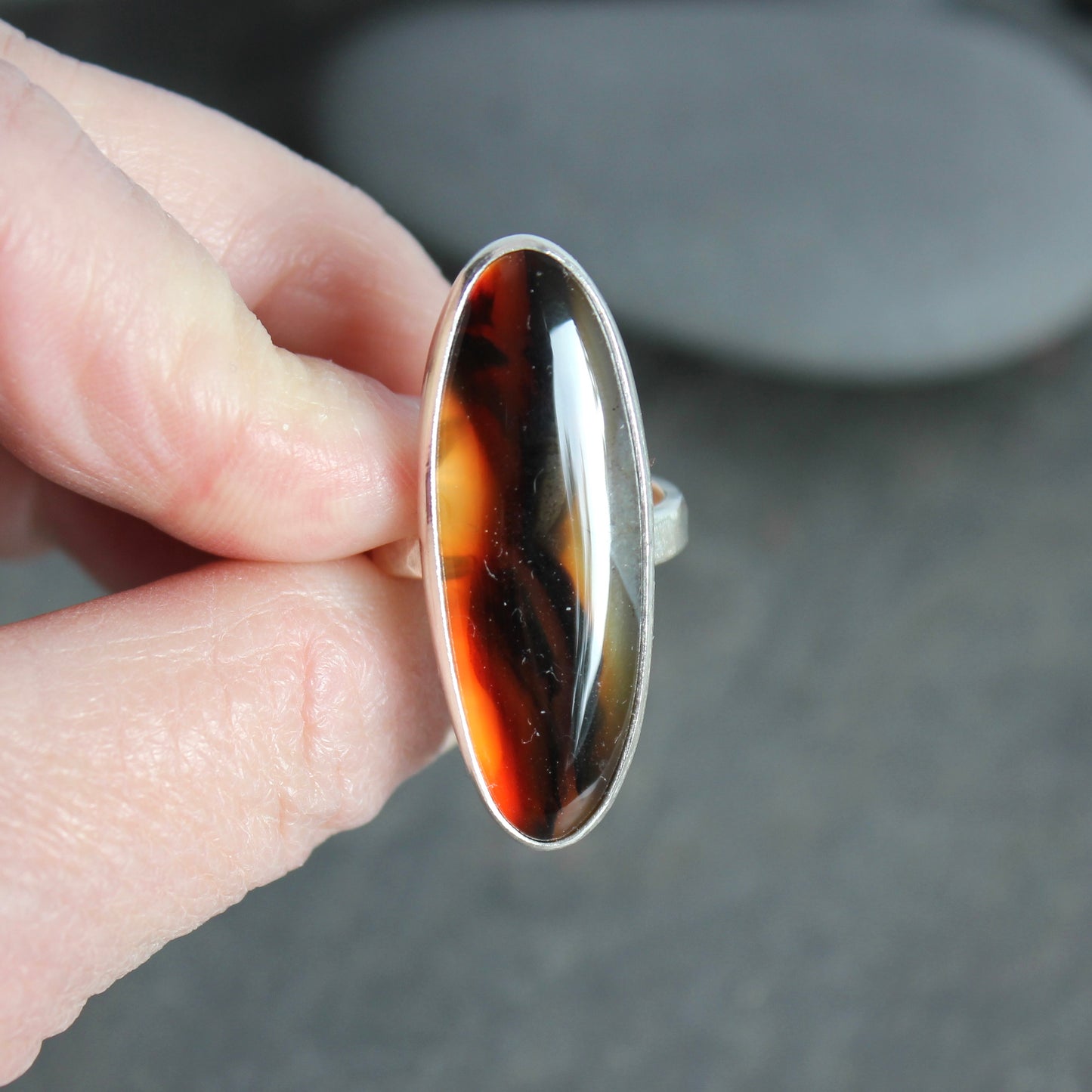 large oval montana agate bezel set ring set in sterling silver