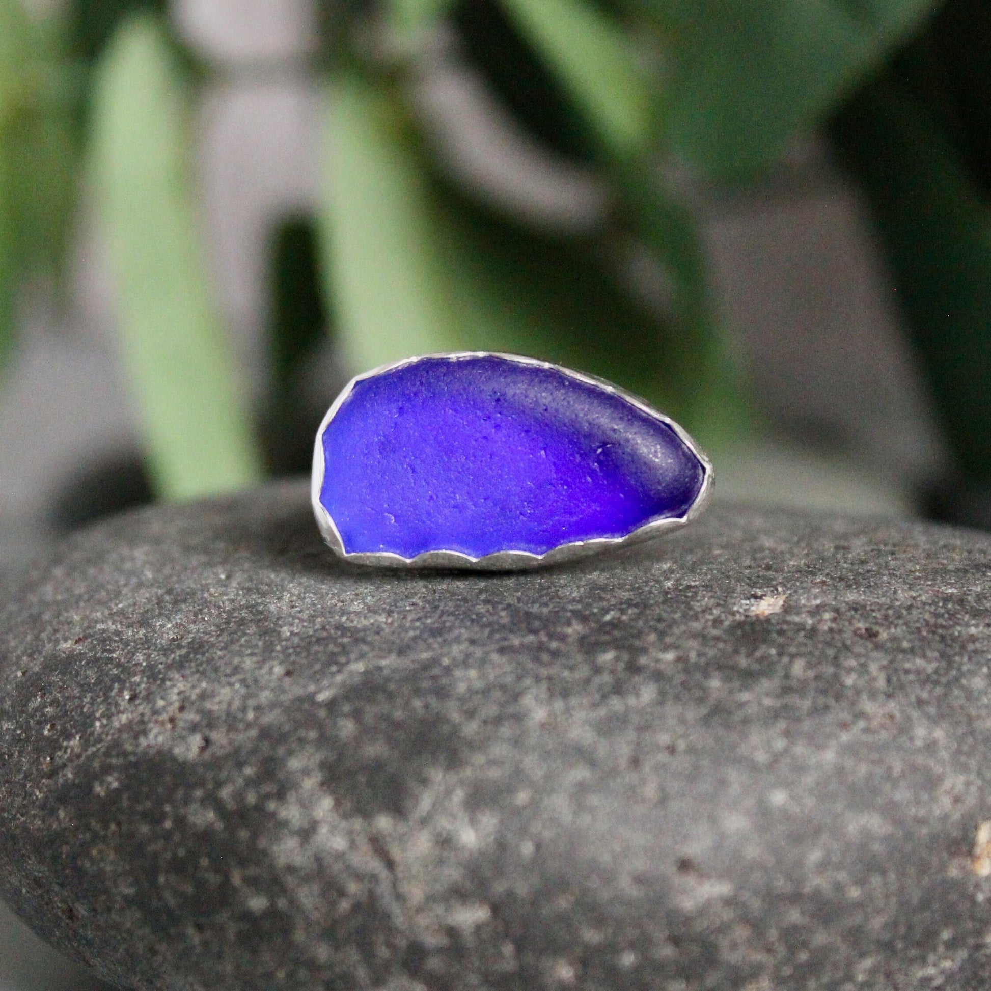 This ring has a piece of Caribbean cobalt blue sea glass set in a fine & sterling silver scalloped bezel and on a sturdy silver band.  Size 6