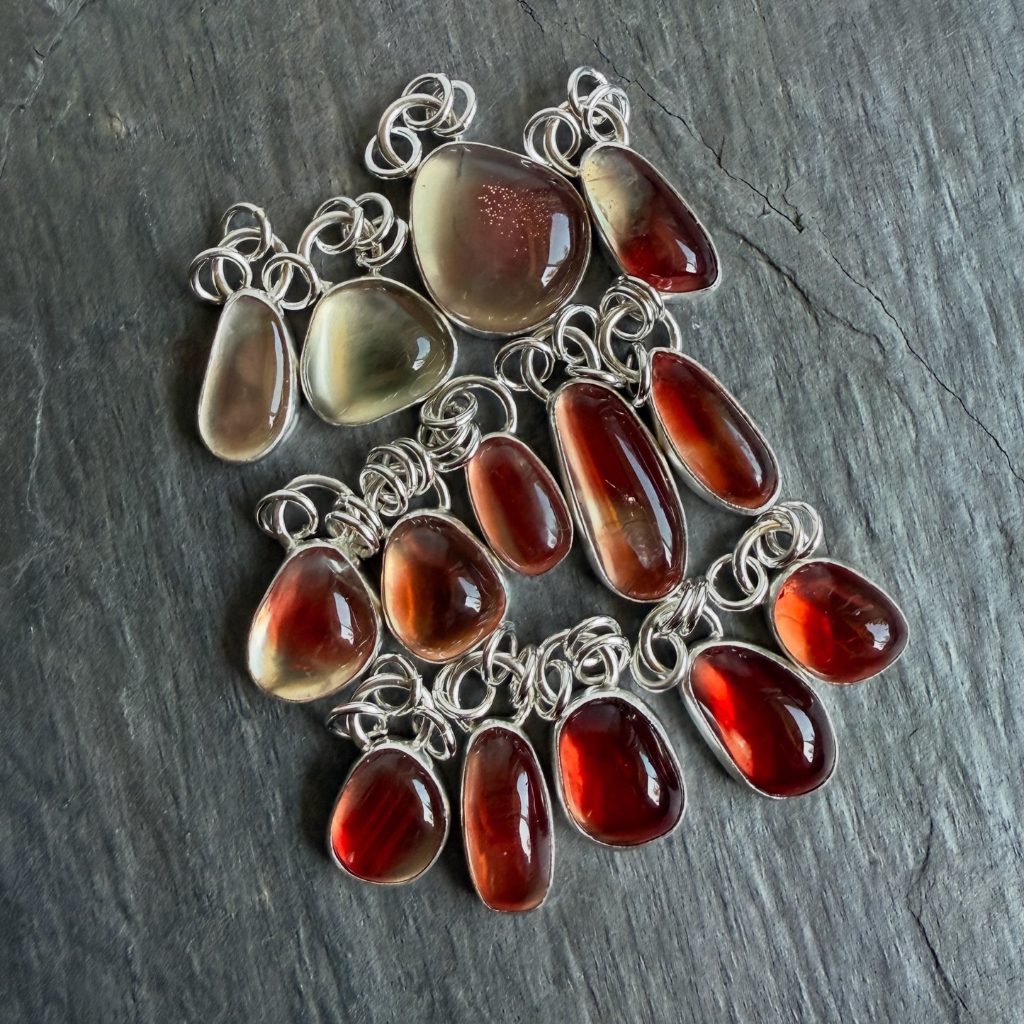 a selection of handmade oregon sunstone pendants by Will Macy of Accent Yourself