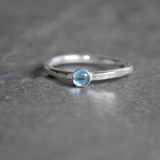 sterling silver stacking ring with a 4mm topaz gemstone